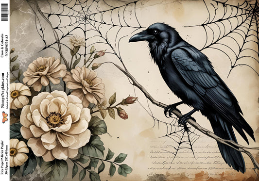 Decorative paper with a black crow, flowers, and spider webs on a textured background.